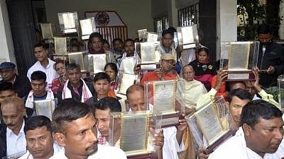 Family members of Assam Movement martyrs return the state honours.
