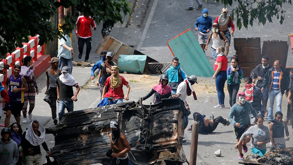 Anti-government protesters face off with security forces as they show support for an apparent mutiny by a national guard unit.