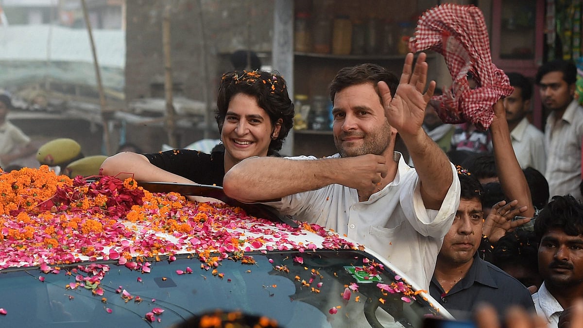 In this 4 May 2014 file photo, Priyanka Gandhi Vadra is seen with her brother and Congress President Rahul Gandhi during a road show in Amethi. 