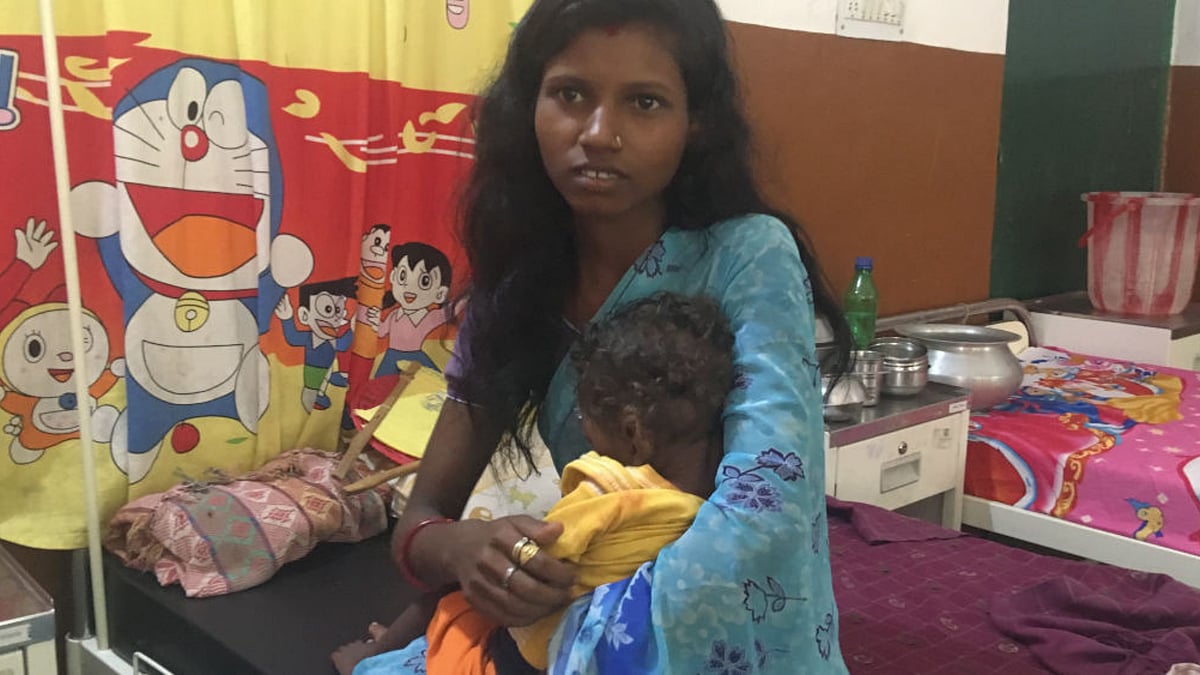Purnima Devi (25) with her 21-month-old child, diagnosed with severe acute malnourishment. 
