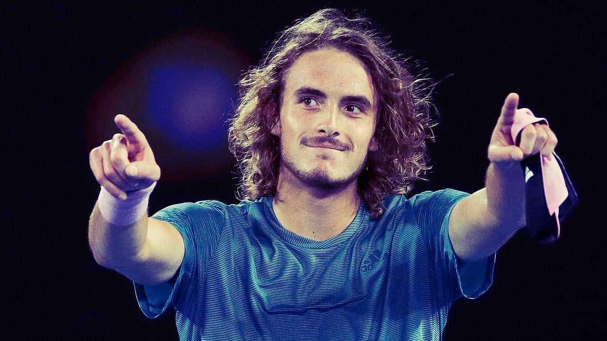 Stefanos Tsitsipas celebrates after stunning Roger Federer in the round of 16 at the Australian Open 2019.