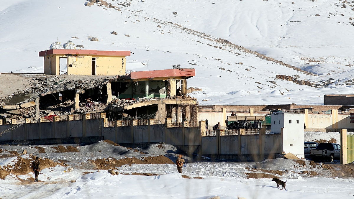 Afghan security forces inspect the site of a Taliban attack in Maidan Shar, capital of Maidan Wardak province, east of Kabul, Afghanistan.