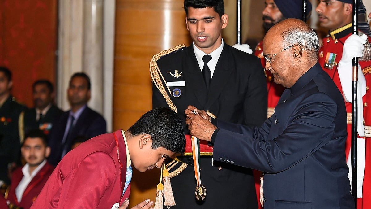 President Ram Nath Kovind presents Bal Shakti Puraskar 2019 in the field of innovation to Aswath Suryanarayanan sports to Angel Vijay Deokule during the Pradhan Mantri Rashtriya Bal Puraskar 2019 function at Rashtrapati Bhavan in New Delhi.