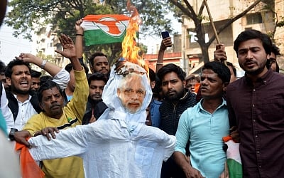 Kolkata: Youth Congress workers stage a demonstration against the film "The Accidental Prime Minister" at Hind Cinema near central Kolkata