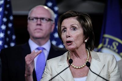 WASHINGTON D.C., July 31, 2014 (Xinhua) -- Nancy Pelosi(Front), Democratic leader of the United States House of Representatives, speaks on a news conference about resolution to sue the U.S. President on Capitol Hill in Washington D.C., capital of the United States, July 30, 2014. The U.S. House on Wednesday approved a lawsuit against President Barack Obama over alleged abuse of executive power. (Xinhua/Bao Dandan/IANS)
