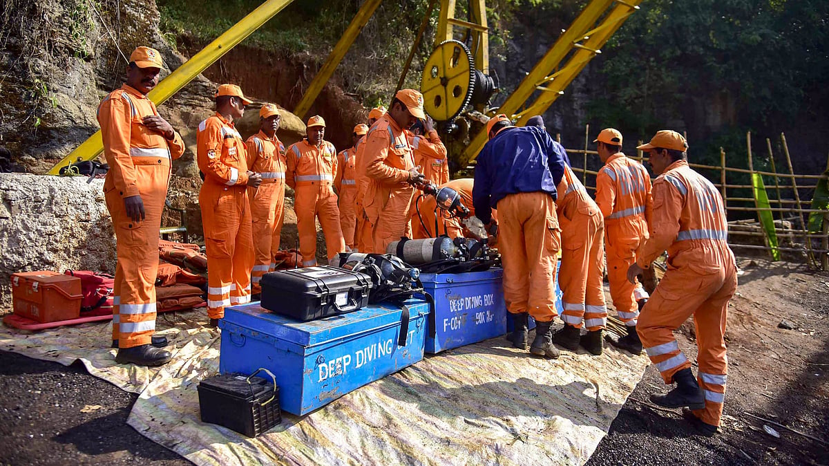 NDRF personnel conduct a rescue task at the site of a coal mine collapse.