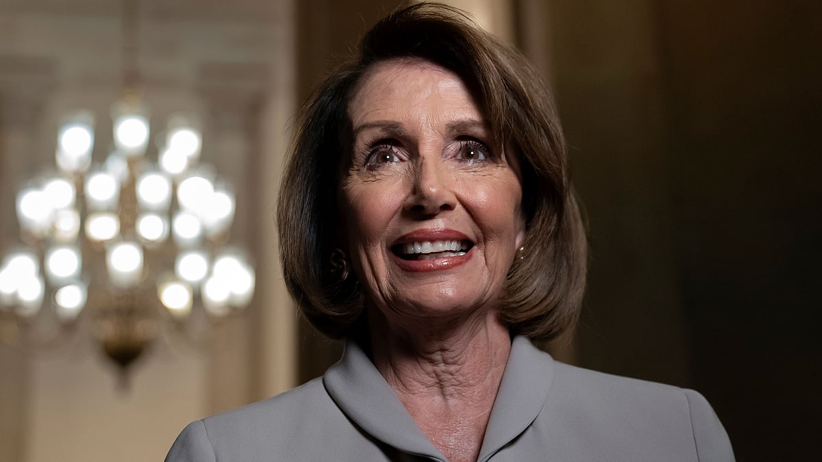 Nancy Pelosi, who will become speaker of the House on 3 January, walks to her new office at the Capitol during a television interview, in Washington, on 2 January, 2019. 