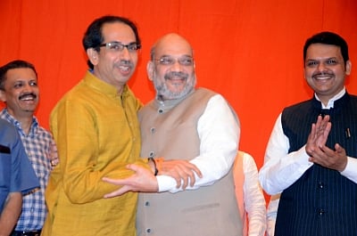 Mumbai: BJP President Amit Shah and Sena President Uddhav Thackeray, along with Maharashtra Chief Minister and BJP leader Devendra Fadnavis during a joint media briefing regarding BJP-Shiv Sena alliance for upcoming Lok Sabha and Maharashtra Assembly elections, in Mumbai on Feb 18, 2019. (Photo: IANS)