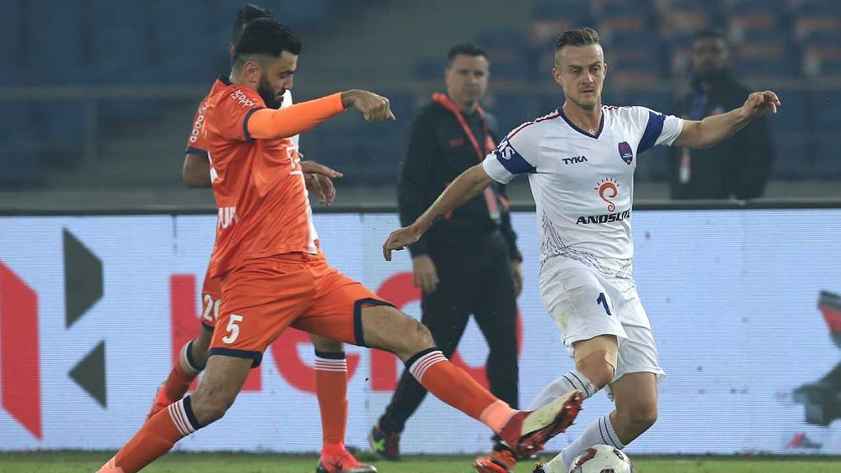 Ahmed Jahouh of FC Goa and Rene Mihelic of Delhi Dynamos FC in action in Hero ISL match on Monday in New Delhi.