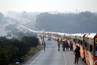 Prayagraj: Uttar Pradesh State Road Transport Corporation (UPSRTC) roll out a fleet of 500 saffron-coloured buses which will cover a distance of over 3.2 km during the longest parade of buses between Sahson toll and Nawabganj toll plaza at NH-19 to set a new record in the Guinness World Records; in Prayagraj, on Feb 28, 2019. The present record of a similar feat is held currently by Abu Dhabi of 390 buses. (Photo: IANS)