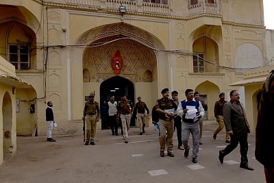 Jaipur: Rajasthan Director General (prisons) NRK Reddy, accompanied by senior officers coming out from the entrance gate of Jaipur central jail where a Pakistani prisoner allegedly murdered by group of fellow prisoners after an argument over a TV programme with other prisoners turned violent; in Jaipur on Feb 20, 2019. The prisoner identified as Shakarullah, alias Mohammad Haneef, 45, who was undergoing imprisonment after being convicted for spying. (Photo: Ravi Shankar Vyas/IANS)