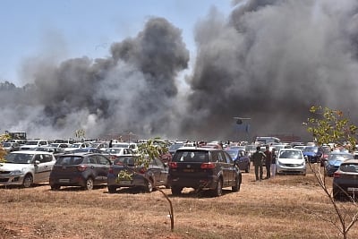 Bengaluru: A fire breaks out in the parking lot in front of Yelahanka Air Force Station gutting 300 cars, in Bengaluru on Feb 23, 2019. (Photo: IANS)