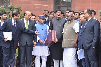 New Delhi: Union Finance and Corporate Affairs Minister Piyush Goyal accompanied by Union Ministers of State for Finance Pon Radhakrishnan and Shiv Pratap Shukla, Economic Affairs Secretary Subhash Chandra Garg, Finance Secretary Ajay Narayan Jha outside North Block before proceeding towards Parliament to present the interim budget, in New Delhi on Feb 1, 2019. (Photo: IANS)