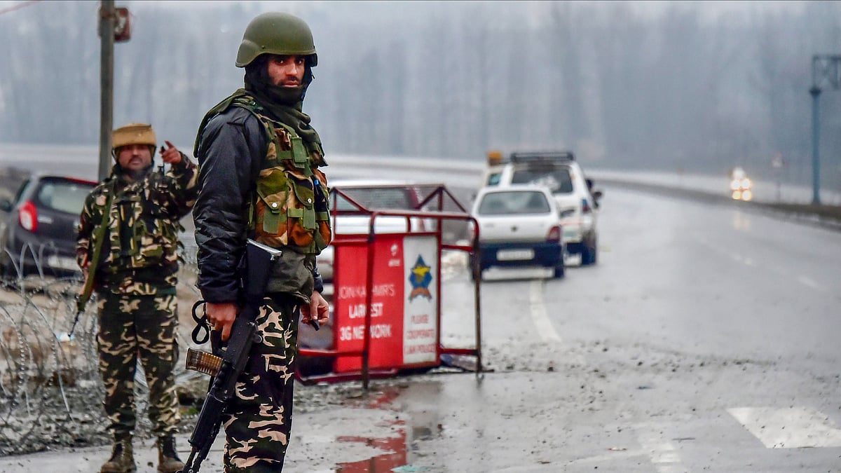 A file photo of Army soldiers standing guard near the site of suicide bomb attack at Lathepora Awantipora in Pulwama district on 14 February.