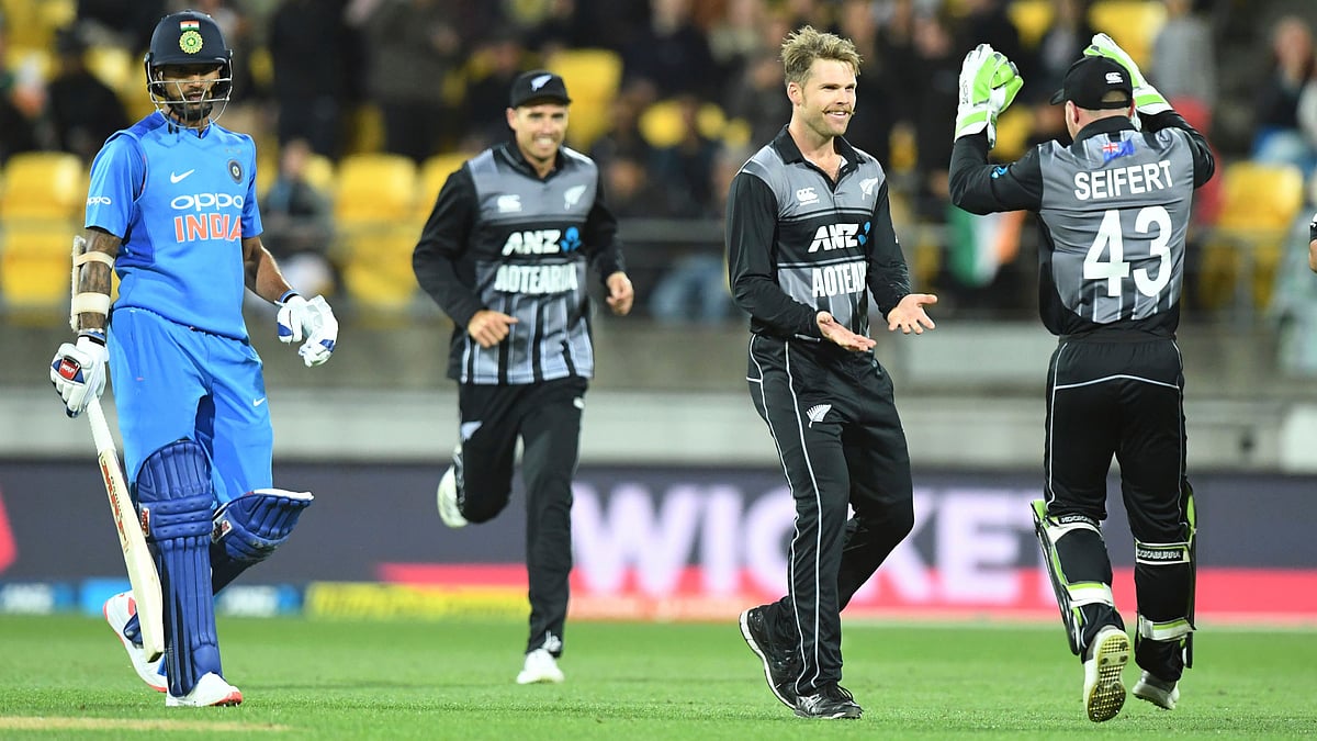 Lockie Ferguson and Tim Seifert celebrate the dismissal of Shikhar Dhawan during the first T20I between New Zealand and India at Wellington.