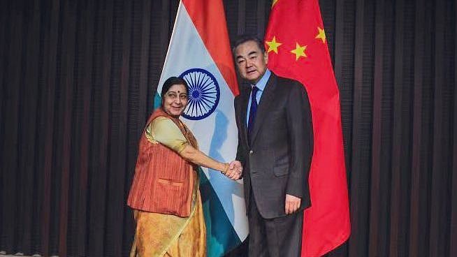 Sushma Swaraj with her Chinese counterpart Wang Yi. 