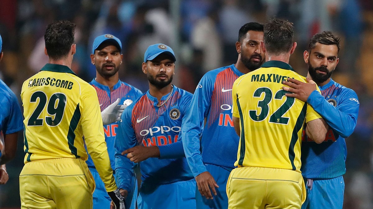 India’s captain Virat Kohli, right, hugs Australia’s Glenn Maxwell to congratulate him on their win in the second T20 international cricket match between India and Australia in Bangalore, India, Wednesday, Feb. 27, 2019.&nbsp;