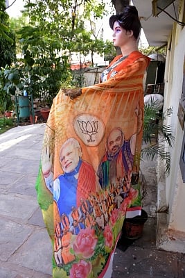 Jaipur: A saree with faces of Prime Minister Narendra Modi and BJP leader Amit Shah on display outside a shop in Jaipur, on March 9, 2019. (Photo: Ravi Shankar Vyas/IANS)