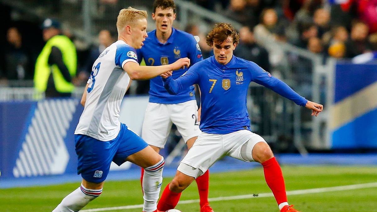 France’s Antoine Griezmann, right, challenges for the ball with Iceland’s Hordur Magnusson during the Euro 2020 group H qualifying soccer match between France and Iceland at Stade de France stadium in Saint Denis on Monday, 25 March.