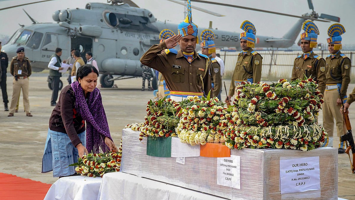 A family member pays tribute to CRPF inspector Pintu Kumar Singh, who was killed in an encounter with militants at north Kashmir’s frontier Kupwara district, at a ceremony, in Patna.&nbsp;