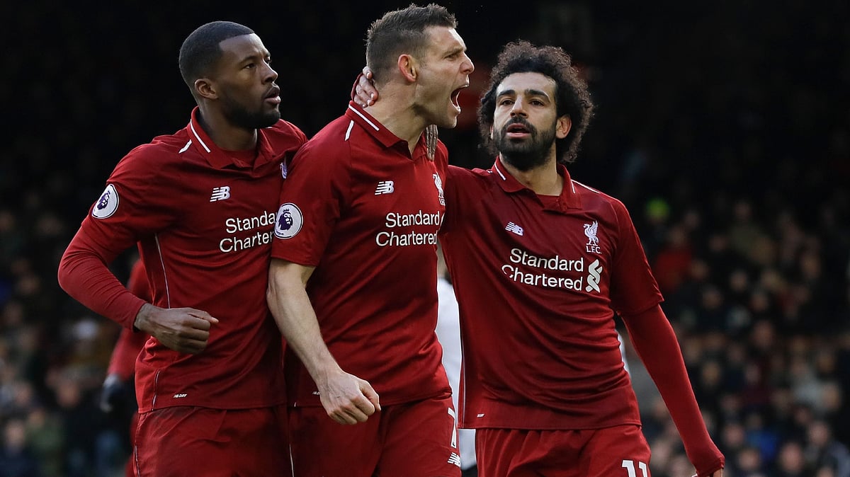 James Milner (centre) celebrates after hitting a decisive 81st-minute penalty in Liverpool’s 2-1 win over Fulham.