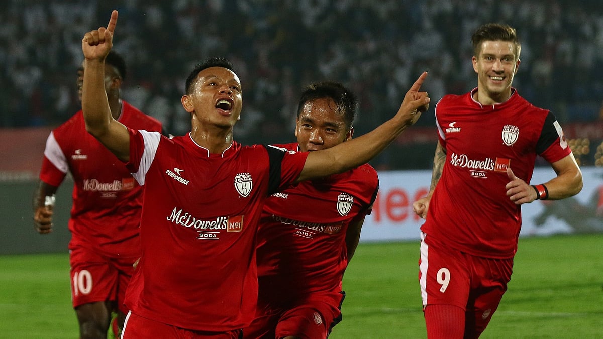 NorthEast United FC players celebrate their lead in the first half against Bengaluru FC on Thursday.