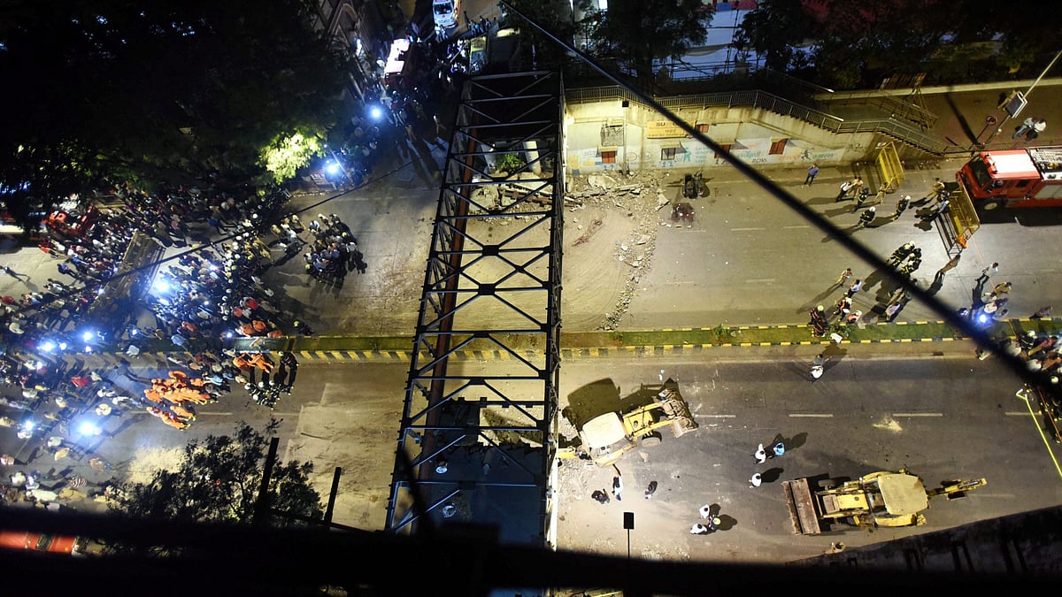A general view shows a part of the partially collapsed foot overbridge near a train station in south Mumbai, Thursday, 14 March, 2019. The bridge connected the bustling Chhatrapati Shivaji Maharaj Terminus railway station with the Azad Maidan Police Station.