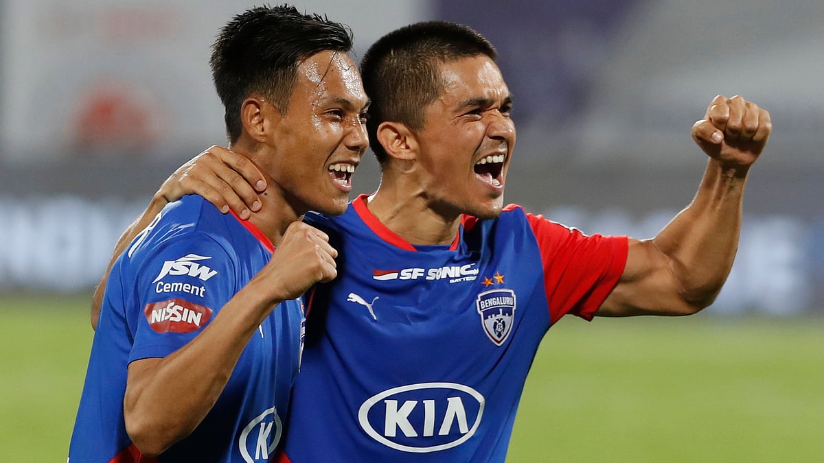 Sunil Chhetri celebrates with Udanta Singh (left) after Bengaluru FC beat NorthEast United FC to enter the Indian Super League 2018/19 finals.