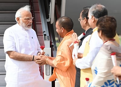 Lucknow: Uttar Pradesh Chief Minister Yogi Adityanath receives Prime Minister Narendra Modi on his arrival in Lucknow, Uttar Pradesh on June 28, 2018. (Photo: IANS/PIB)