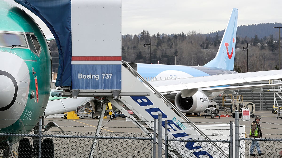 In this file photo, a Boeing 737 MAX 8 airplane sits parked in the background.&nbsp;
