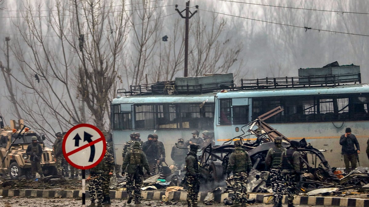 Security personnel carry out rescue and relief works at the site of the suicide bomb attack in Pulwama district of J&K on 14 February. 