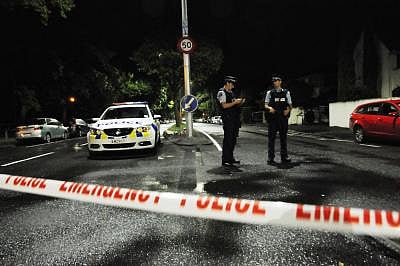 CHRISTCHURCH, March 15, 2019 (Xinhua) -- Policemen are seen on a road near the scene where the terror attacks occurred in Christchurch, New Zealand, March 16, 2019. At least 49 people were killed and 48 others wounded in the attacks on two mosques of New Zealand