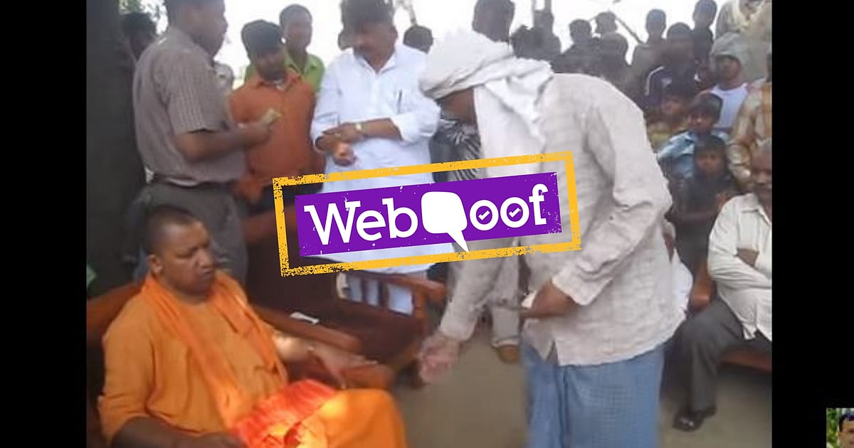 Image accompanying Uttar Pradesh Chief Minister Yogi Adityanath distributing cash ahead of the Lok Sabha elections.