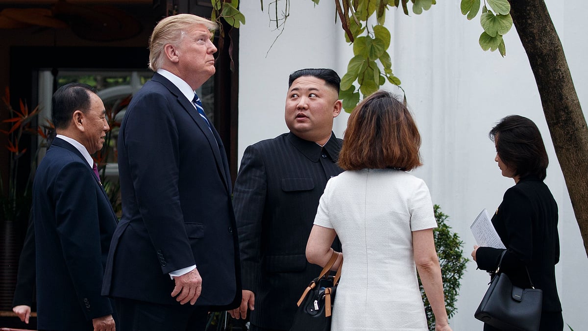 President Donald Trump and North Korean leader Kim Jong-un take a walk after their meeting in Hanoi, Vietnam.