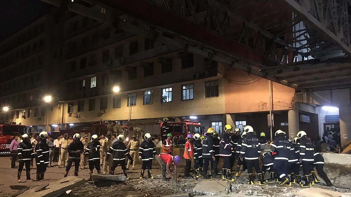 Rescue work in progress after a foot overbridge near a train station collapsed in south Mumbai,