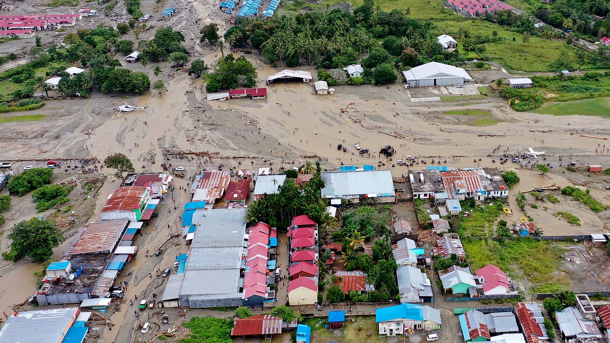This aerial shot taken on Sunday, 17 March, 2019 shows the area affected by flash floods in Sentani, Papua province, Indonesia. Flash floods and mudslides triggered by downpours tore through mountainside villages in Indonesia’s easternmost province, killing dozens of people, disaster officials said.