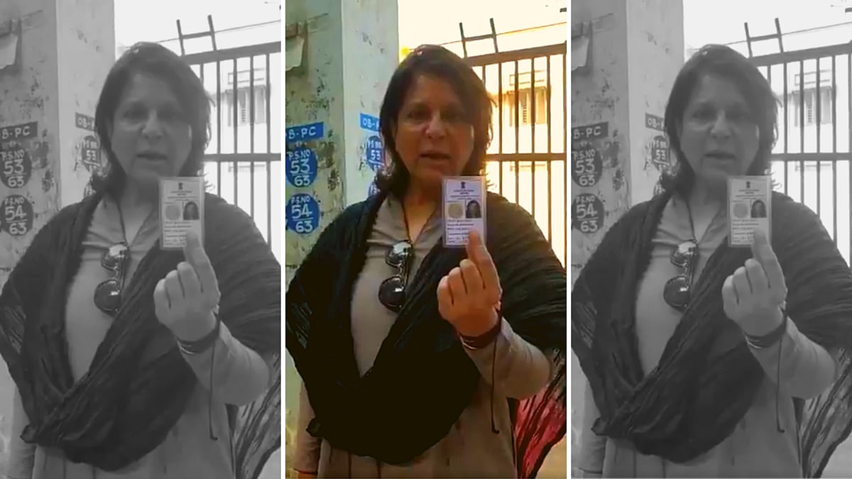 Shobhana Kamineni holds up her voter ID card.