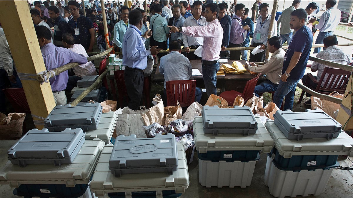 In this 10 April, 2019, photo, polling officials wait to receive electronic voting machines and voter-verifiable paper audit trail (VVPAT). Image used for representational purpose only.