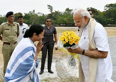 Santiniketan: Prime Minister Narendra Modi being received by West Bengal Chief Minister Mamata Banerjee on his arrival at Santiniketan, in West Bengal on May 25, 2018. (Photo: IANS/PIB)