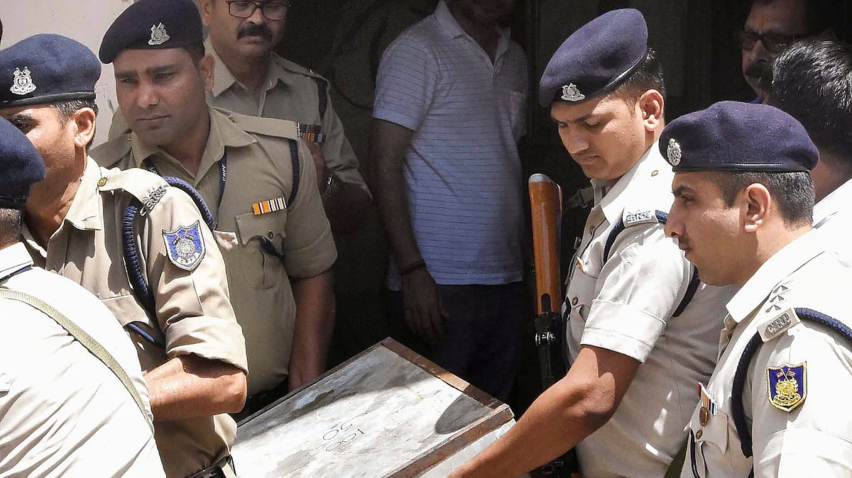 CRPF jawans at the premises of lobbyist Ashwini Sharma after Income Tax officials recovered cash during raids, in Bhopal.