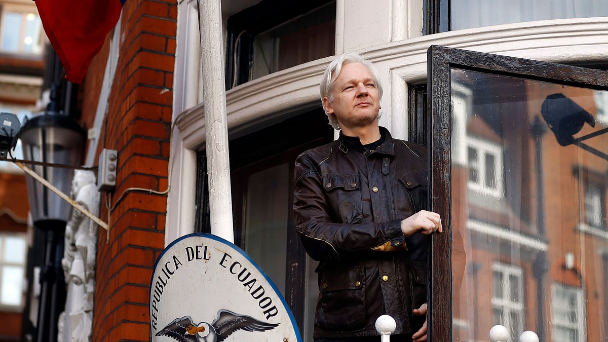 File photo of WikiLeaks founder Julian Assange greeting supporters outside the Ecuadorian embassy in London.