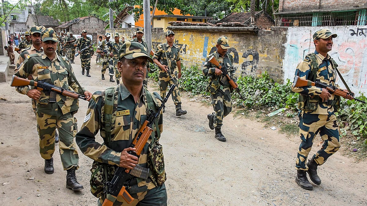 Paramilitary jawans conduct march in a locality at Beldanga, ahead of Lok Sabha elections, in Murshidabad district of West Bengal.