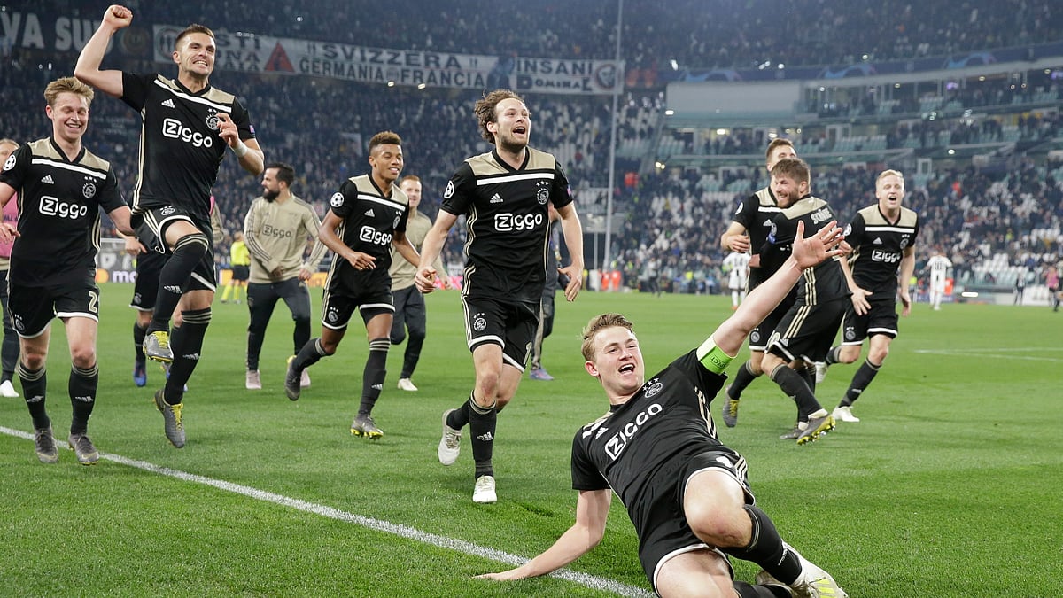 Ajax’s Matthijs de Ligt and teammates celebrate at the end of the Champions League, quarterfinal, second leg soccer match between Juventus and Ajax, at the Allianz stadium in Turin on Tuesday, 16 April. 