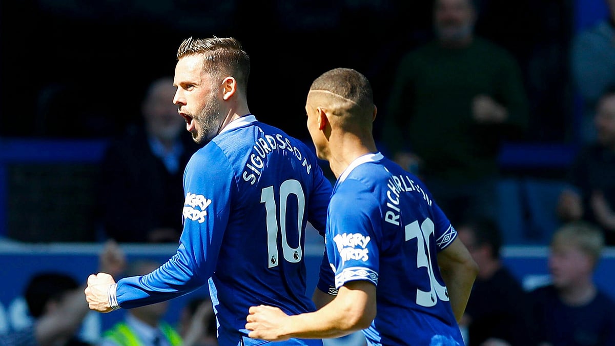 Everton’s Gylfi Sigurdsson, left, celebrates scoring against Manchester United with teammate Richarlison during the English Premier League soccer match at Goodison Park, Liverpool, England, Sunday April 21, 2019. 