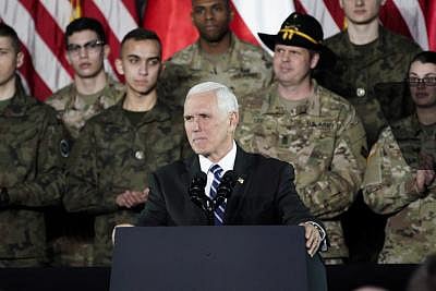 WARSAW, Feb. 13, 2019 (Xinhua) -- U.S. Vice President Mike Pence (C) speaks to the troops at a military base in Warsaw, Poland, on Feb. 13, 2019. Pence