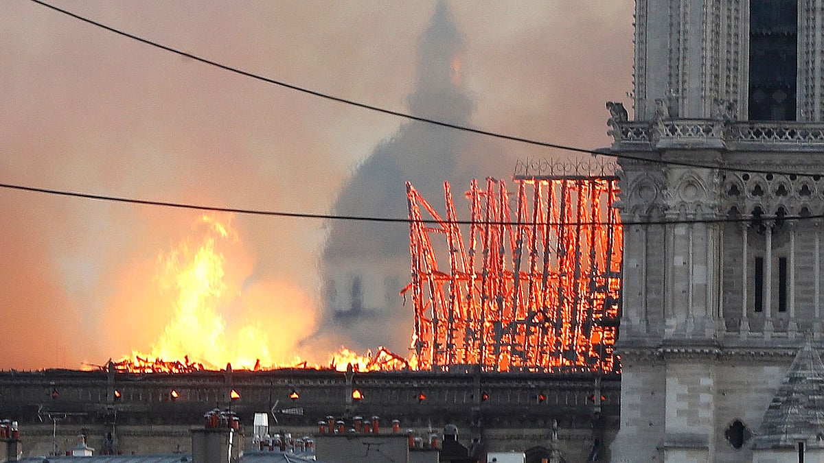 Flames rise from Notre Dame cathedral as it burns in Paris.