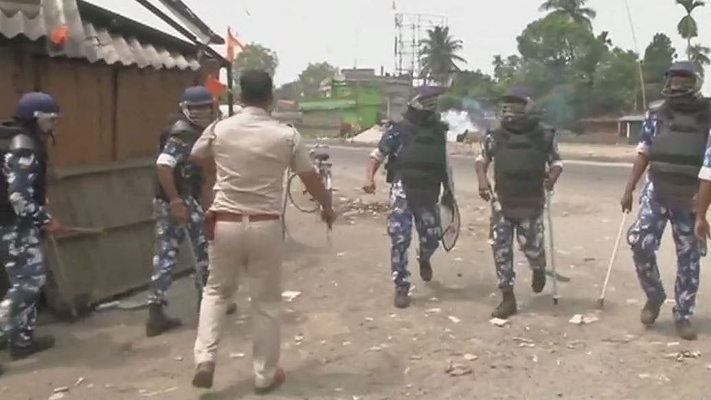 Police uses tear gas to disperse the locals blocking the highway after they were refused to cast their vote.