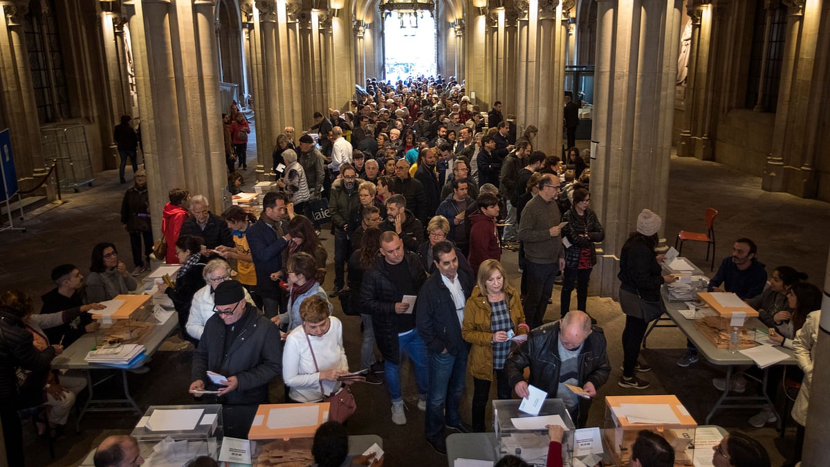 People cast their votes during Spain’s general election in a polling station in Barcelona, Spain, Sunday, 28 April 2019. 