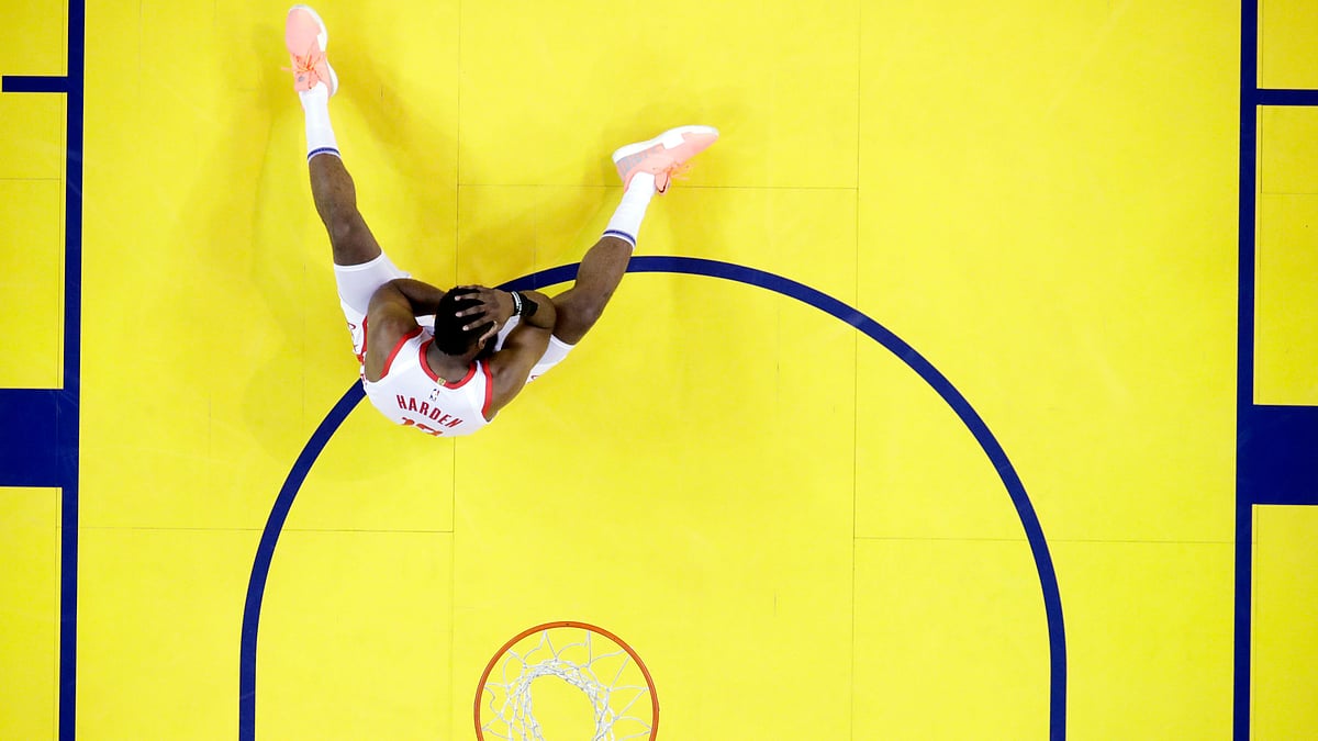 James Harden sits on court after his injury.