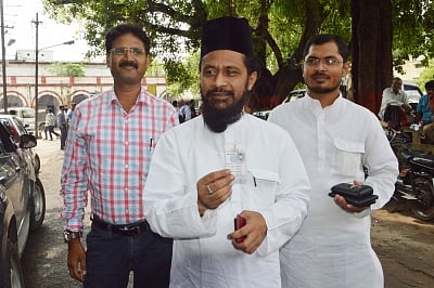 Patna: JD(U) leader Ghulam Rasool Balyawi arrives to cast his vote during the Vidhan Parishad elections in Patna on July 7, 2015. (Photo: IANS)